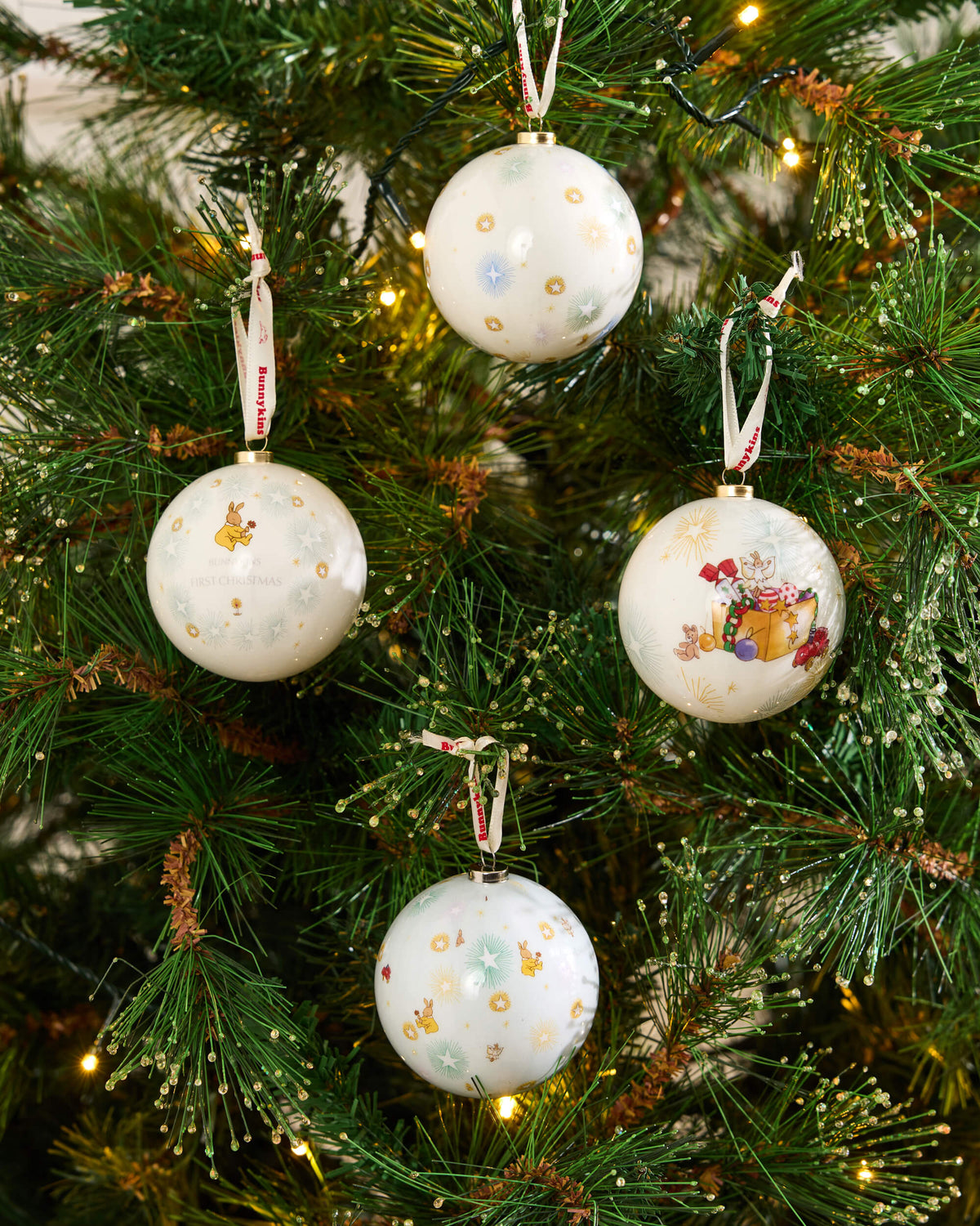Royal Doulton Bunnykins Christmas baubles styled on a festive tree