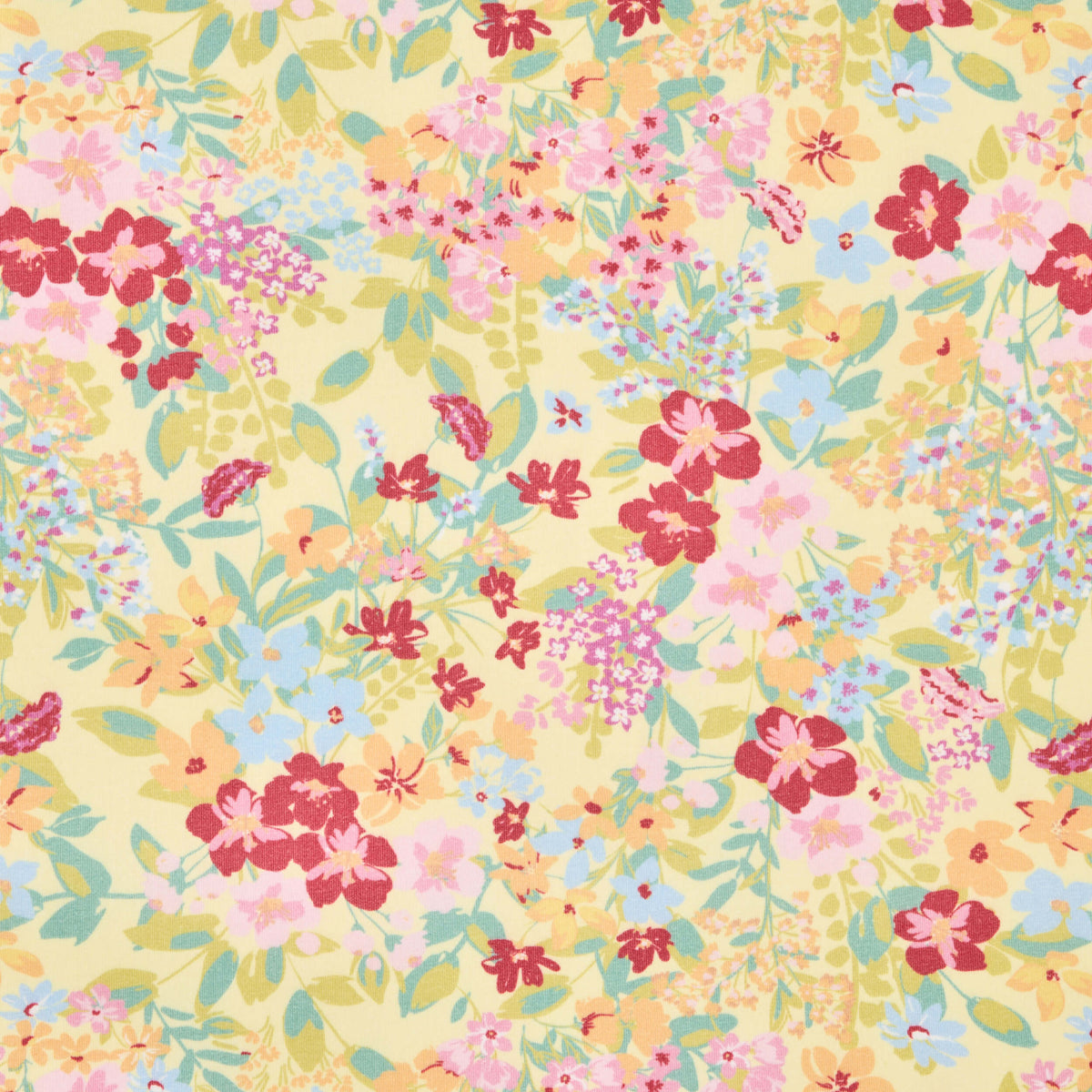 Twill & Co floral nursery print with red and pink blossoms, green leaves and a yellow background