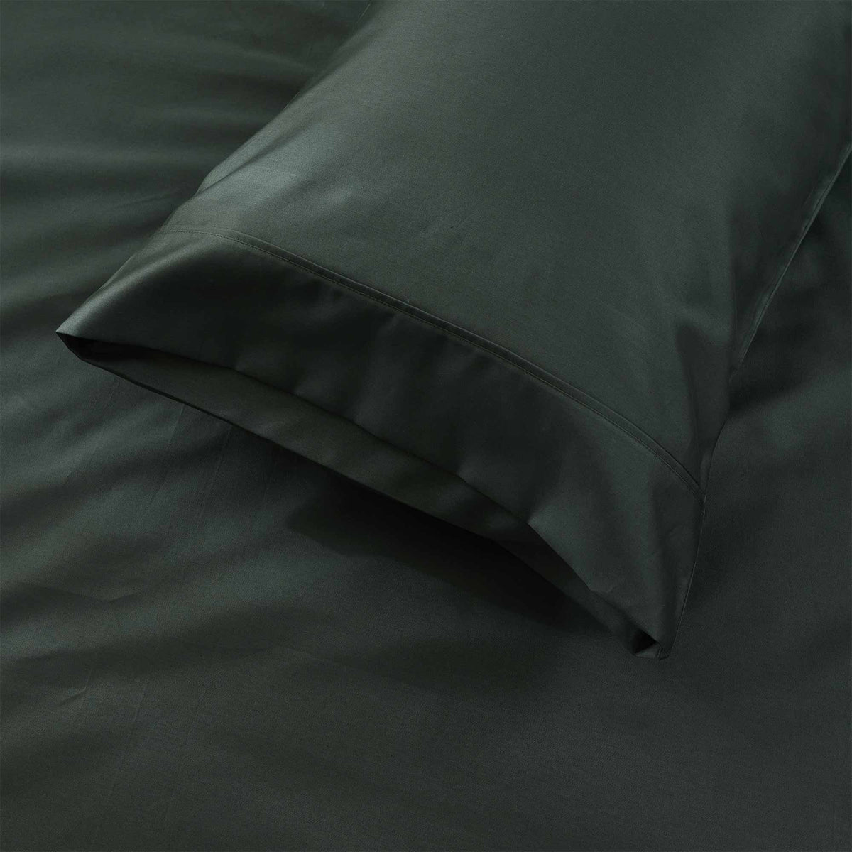 Royal Doulton Sola Forest pillowcase resting on matching sheets