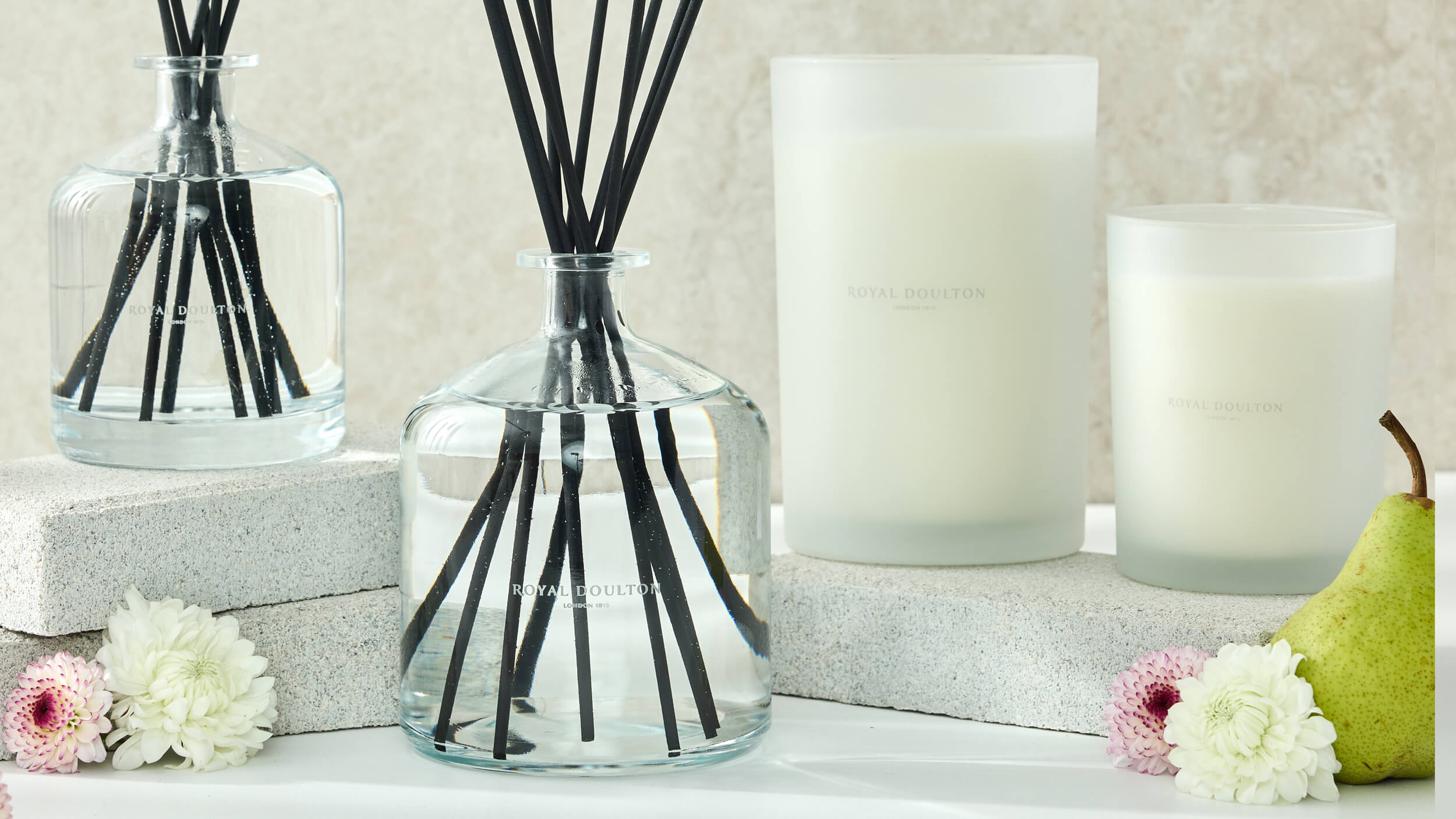 Royal Doulton Mayfair clear glass diffusers and white candles with flowers and pear