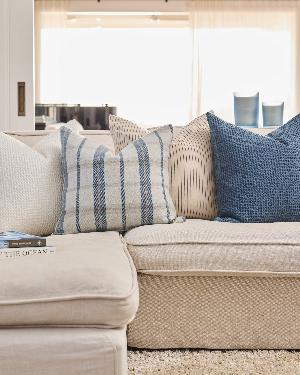 Royal Doulton blue cushions styled in a living room