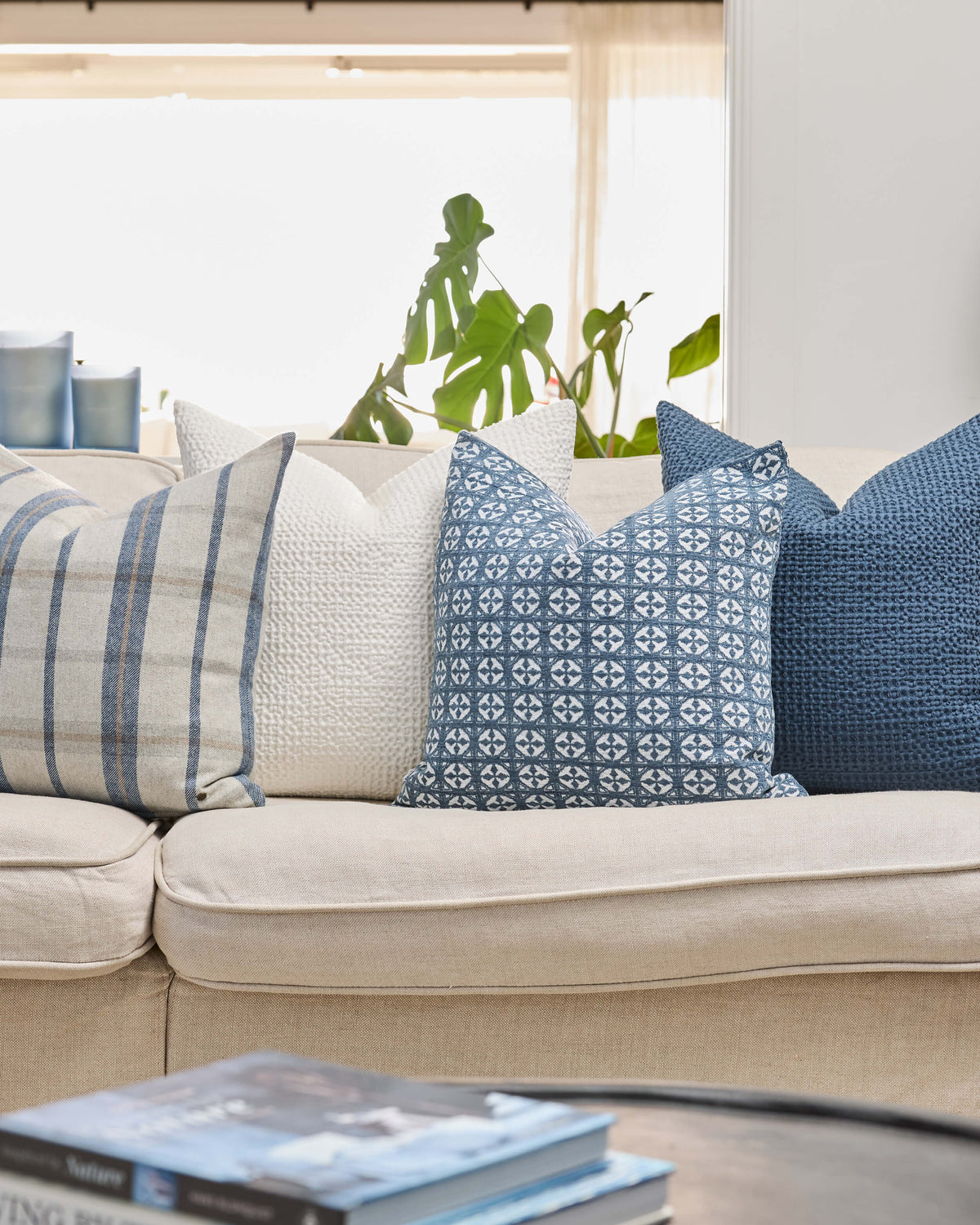 Royal Doulton blue cushions styled in a living room