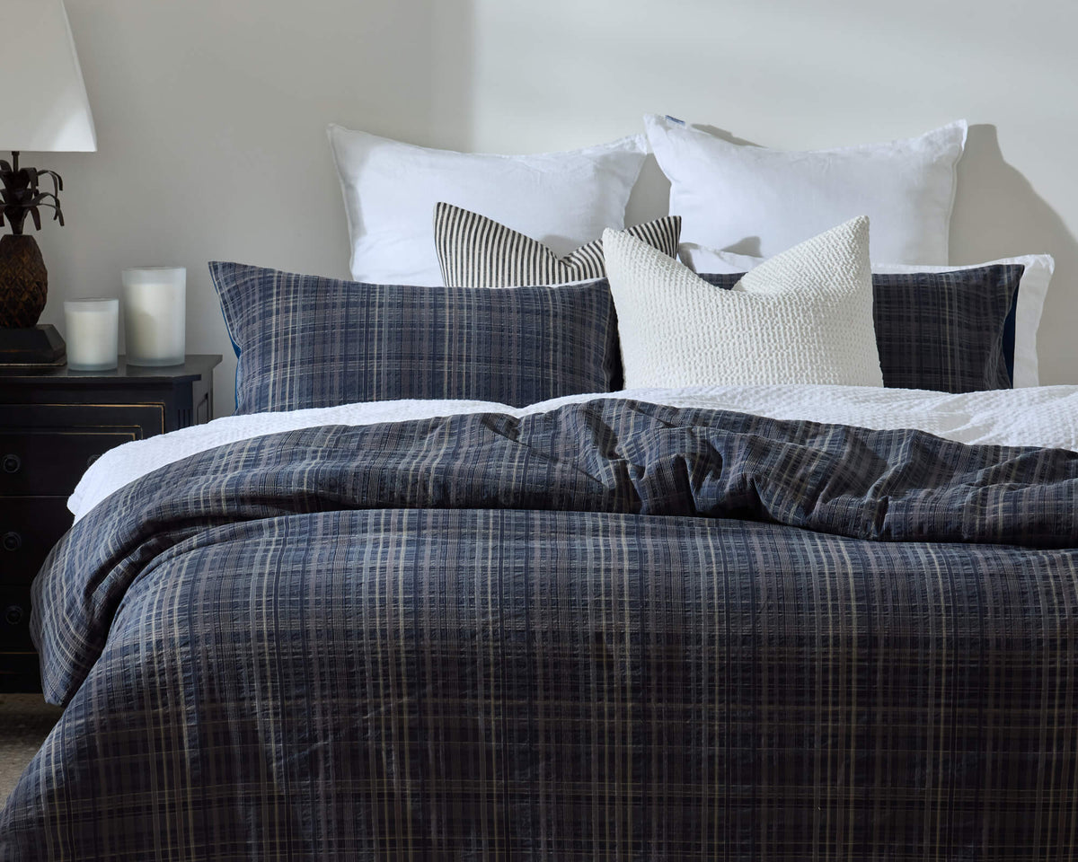Royal Doulton Devon duvet cover styled on a bed with coordinating cushions