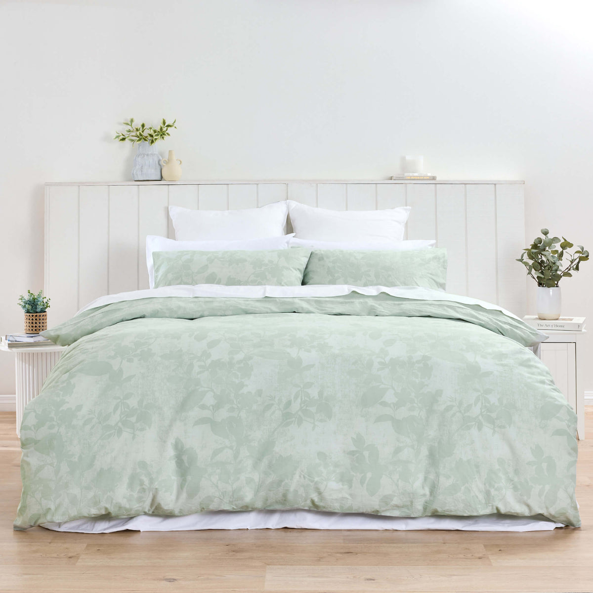 Mint-green Twill & Co Lola floral duvet cover and pillowcases shown across a bed with white pillows