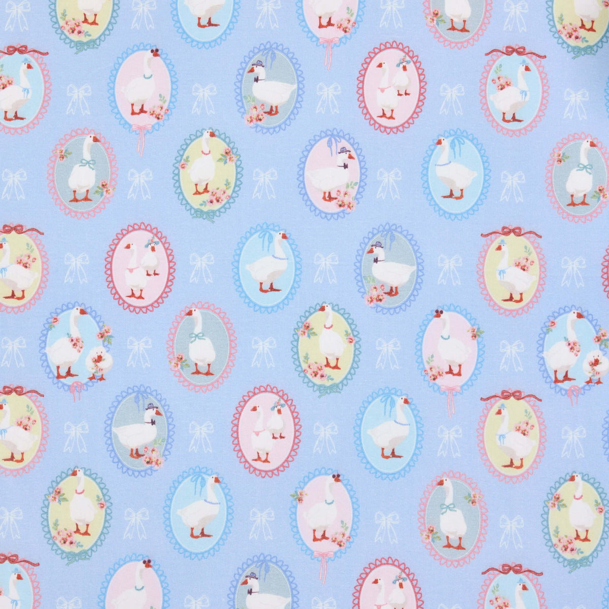 White geese in pastel oval frames with bows on a blue Twill & Co nursery print