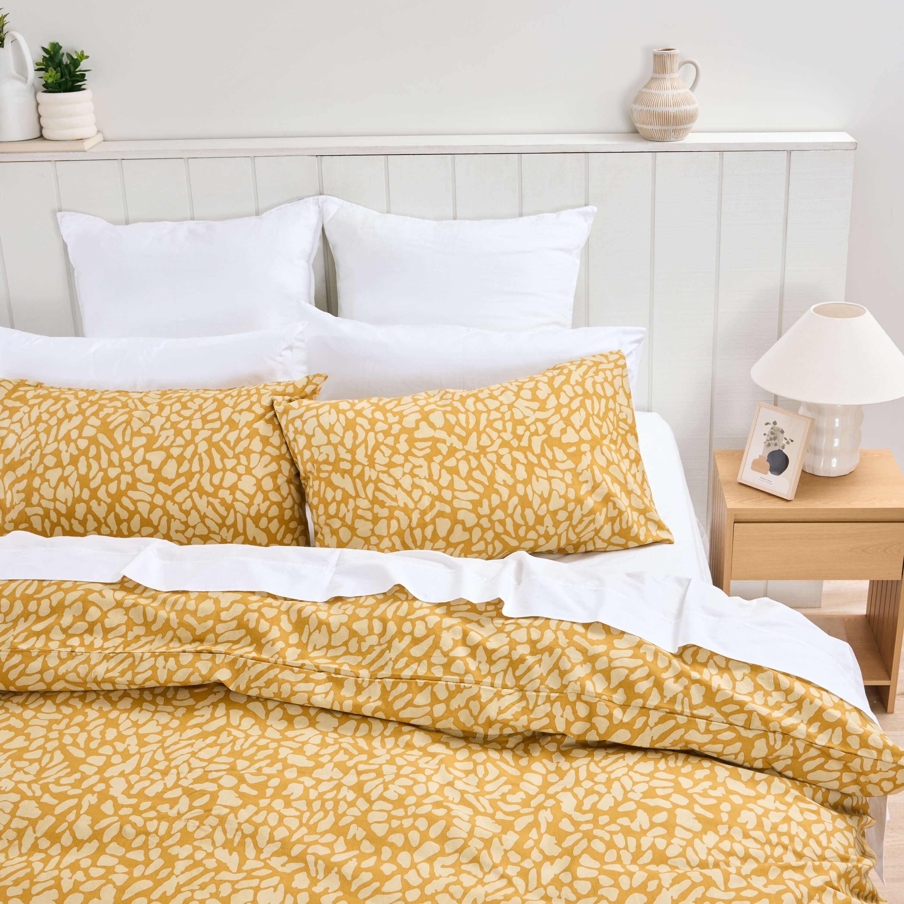 Twill and Co mustard yellow patterned bedding in a bright bedroom