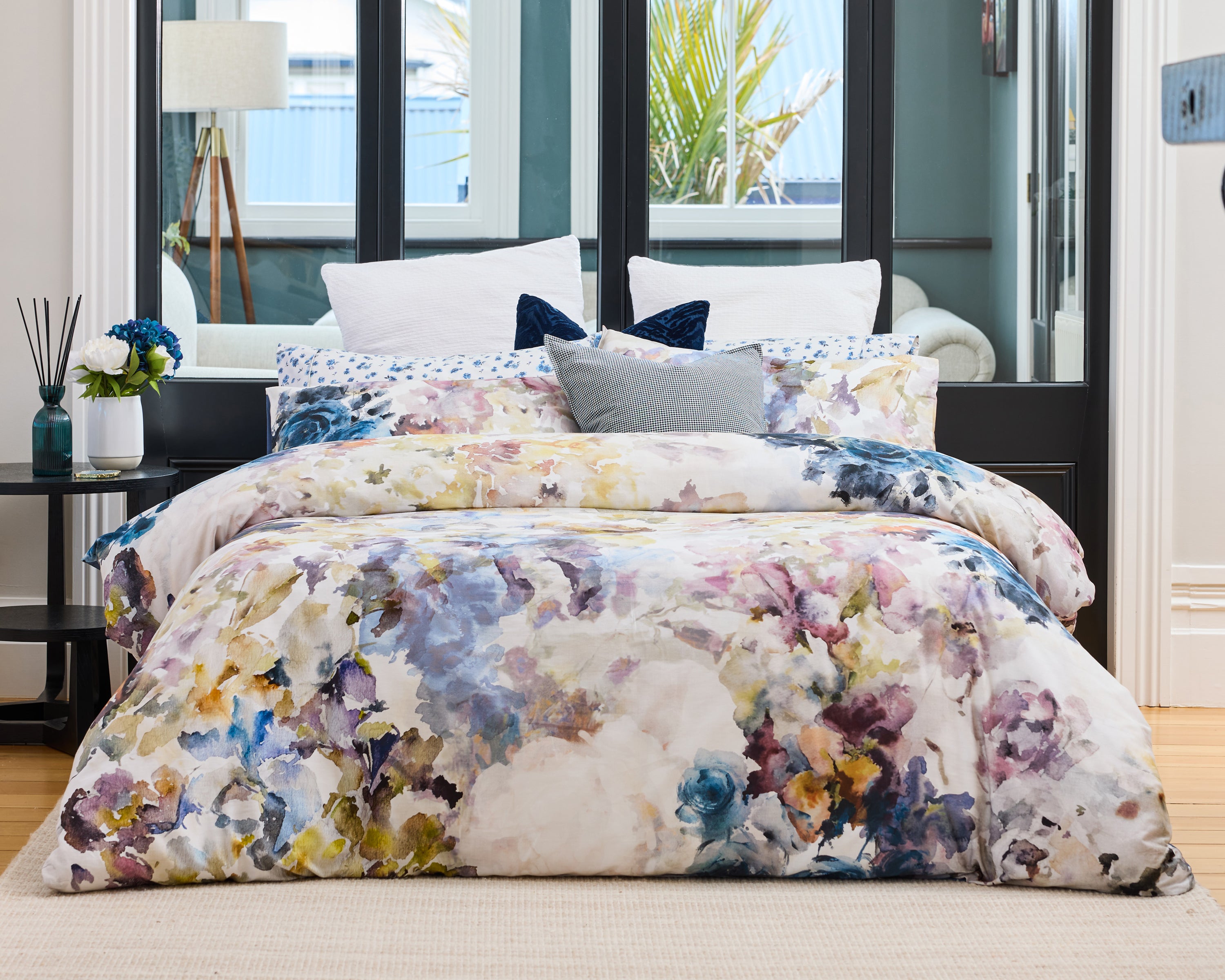 June & Jupiter Rosa watercolour floral bedding styled on a bed