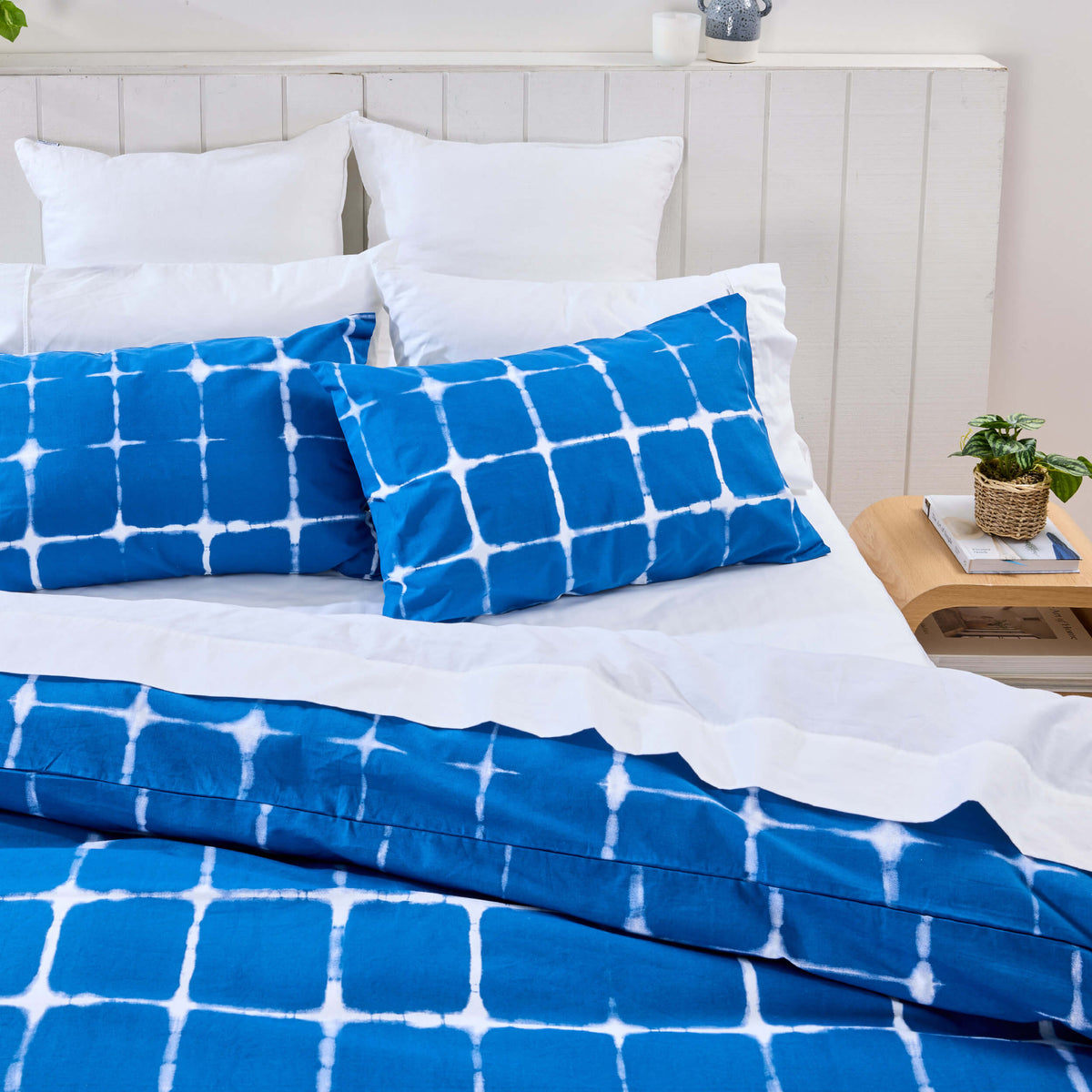 Twill & Co dark blue tie-dye bedding with white grid lines and matching square-patterned pillowcases