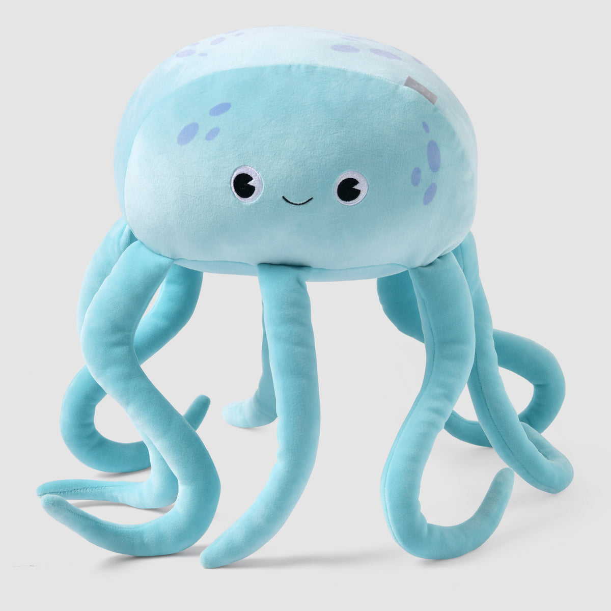 Pale blue Twill & Co sea-creature cushion with a smiling face and long curling tentacles