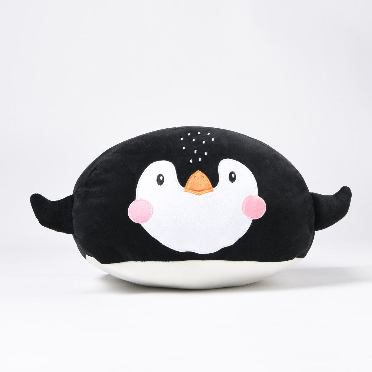 Black and white Twill & Co penguin cushion with pink cheeks and an orange beak